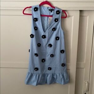 Sister Jane blue sleeveless dress with black crochet flowers.